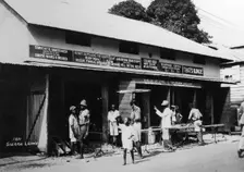People outside an undertaker's premises, Sierra Leone, 20th century