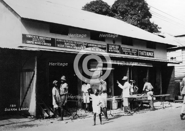 People outside an undertaker's premises, Sierra Leone, 20th century. Artist: Unknown