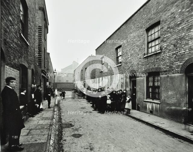 People outside boarded-up houses in Ainstey Street, Bermondsey, London, 1903. Artist: Unknown.
