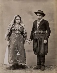 People of Leon, a man and woman holding hands, wearing traditional dress, c1880. Creator: Juan Laurent