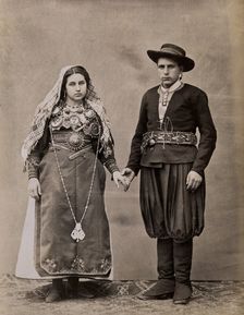 People of Leon, a man and woman holding hands, wearing traditional dress, c1880. Creator: Juan Laurent