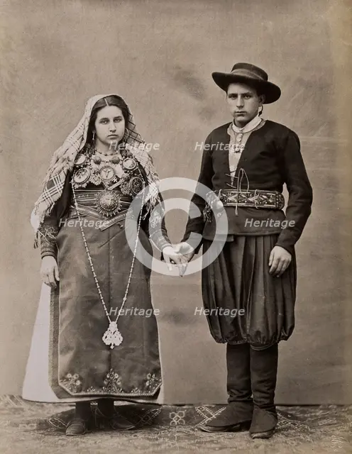 People of Leon, a man and woman holding hands, wearing traditional dress, c1880. Creator: Juan Laurent.