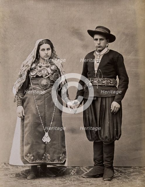People of Leon, a man and woman holding hands, wearing traditional dress, c1880. Creator: Juan Laurent.