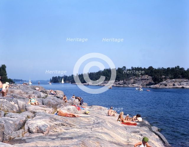 People on the rocks at Gryt Archipelago, Sweden, 1973. Creator: Torkel Lindeberg.