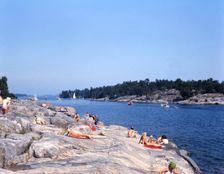 People on the rocks at Gryt Archipelago, Sweden, 1973. Creator: Torkel Lindeberg
