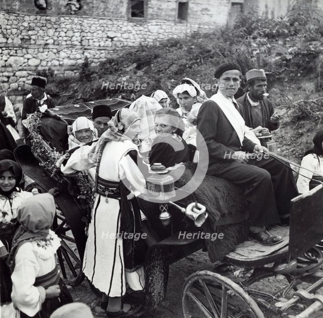 People on their way to Kolo dancing, Sarajevo, Bosnia-Hercegovina, Yugoslavia, 1939. Creator: Unknown.