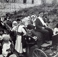 People on their way to Kolo dancing, Sarajevo, Bosnia-Hercegovina, Yugoslavia, 1939. Creator: Unknown