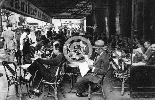 People at a pavement cafe, Paris, 1931.Artist: Ernest Flammarion