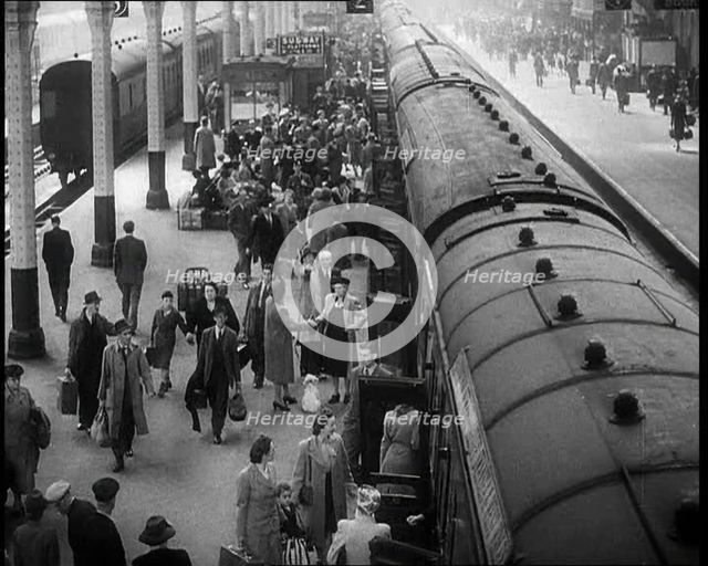 People at  a Train Station, 1933. Creator: British Pathe Ltd.