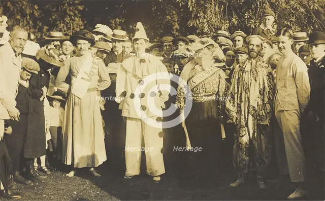 People at Rickmansworth, Herts, some in drag, gather outside at a swimmming gala, 1908. Creator: Unknown.