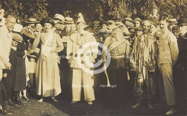 People at Rickmansworth, Herts, some in drag, gather outside at a swimmming gala, 1908. Creator: Unknown.