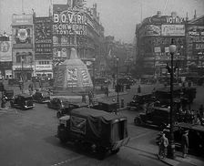 People and Traffic Moving Through a Busy Junction in London, 1943. Creator: British Pathe Ltd
