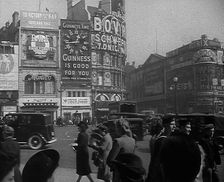 People and Traffic Moving Across Piccadilly Circus, 1943. Creator: British Pathe Ltd