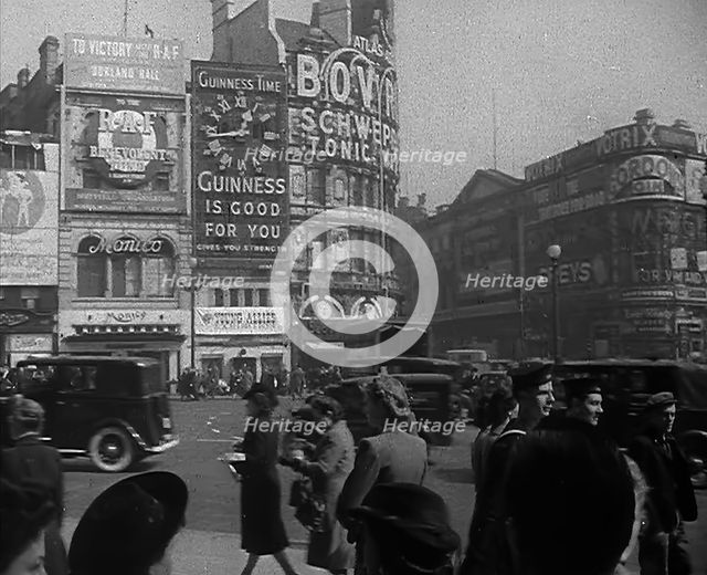 People and Traffic Moving Across Piccadilly Circus, 1943. Creator: British Pathe Ltd.
