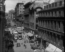 People and Traffic Moving Along Crowded Streets, 1940. Creator: British Pathe Ltd