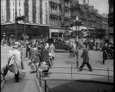 People and Traffic Moving Along Crowded Streets, 1940. Creator: British Pathe Ltd