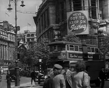 People and Traffic Moving Around a City, 1941. Creator: British Pathe Ltd