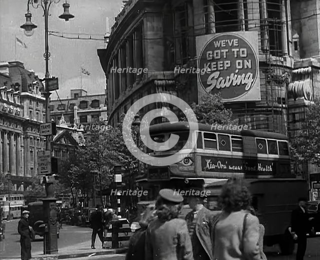 People and Traffic Moving Around a City, 1941. Creator: British Pathe Ltd.