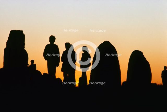 People by Ale's Stones, Kåseberga, Scania, Sweden. Creator: Stefan Hallberg.