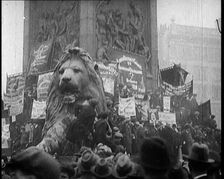 People Climbing Over the Lions at the Foot of Nelson's Column in Trafalgar Square, London..., 1922. Creator: British Pathe Ltd