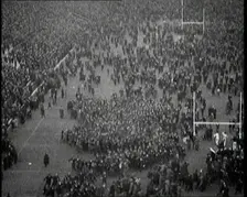 People Crowding the Pitch After an American Football Game, 1922. Creator: British Pathe Ltd