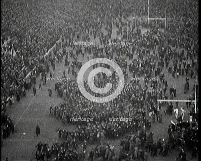 People Crowding the Pitch After an American Football Game, 1922. Creator: British Pathe Ltd.