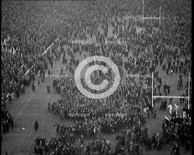 People Crowding the Pitch After an American Football Game, 1922. Creator: British Pathe Ltd.