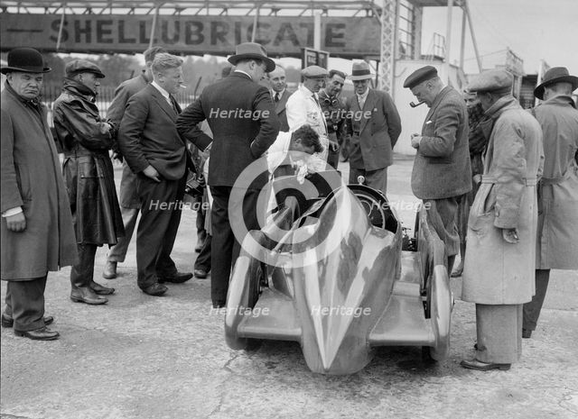 People examining Leon Cushman's Austin 7 racer at Brooklands for a speed record attempt, 1931. Artist: Bill Brunell.