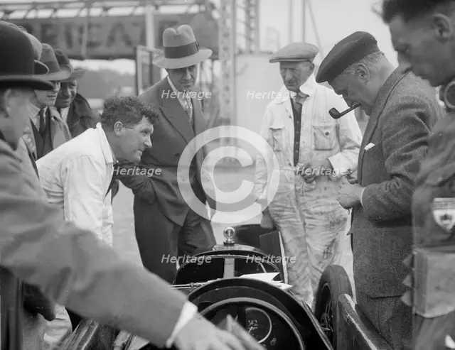 People examining Leon Cushman's Austin 7 racer at Brooklands for a speed record attempt, 1931. Artist: Bill Brunell.
