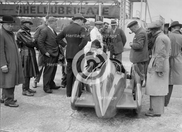 People examining Leon Cushman's Austin 7 racer at Brooklands for a speed record attempt, 1931. Artist: Bill Brunell.