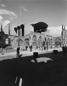 People exploring the ruins of the Cathedral Church of St Michael, Coventry, 1962. Creator: John Laing plc