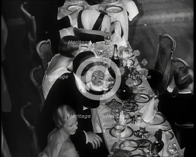 People Eating Dinner, 1930s. Creator: British Pathe Ltd.