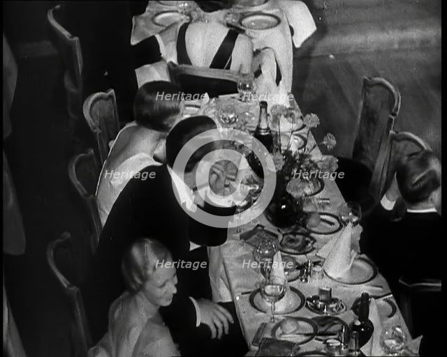 People Eating Dinner, 1930s. Creator: British Pathe Ltd.