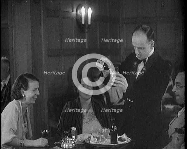 People Enjoying Drinks on a Cruise Liner Whilst at Sea, 1931. Creator: British Pathe Ltd.