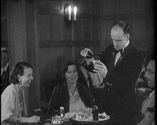 People Enjoying Drinks on a Cruise Liner Whilst at Sea, 1931. Creator: British Pathe Ltd