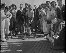 People Enjoying Games on Deck of a Cruise Liner Whilst at Sea, 1931. Creator: British Pathe Ltd