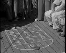 People Enjoying Games on Deck of a Cruise Liner Whilst at Sea, 1931. Creator: British Pathe Ltd