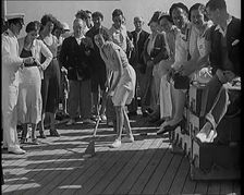 People Enjoying Games on Deck of a Cruise Liner Whilst at Sea, 1931. Creator: British Pathe Ltd