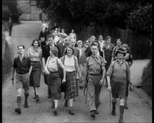 People Hiking Down a Road Towards the Camera, 1933. Creator: British Pathe Ltd