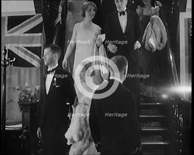 People in Evening Dress Walking Down Stairs, 1931. Creator: British Pathe Ltd.