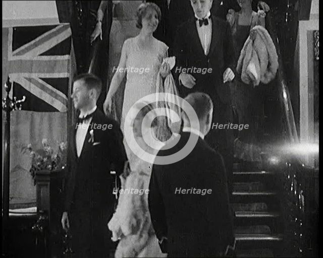 People in Evening Dress Walking Down Stairs, 1931. Creator: British Pathe Ltd.