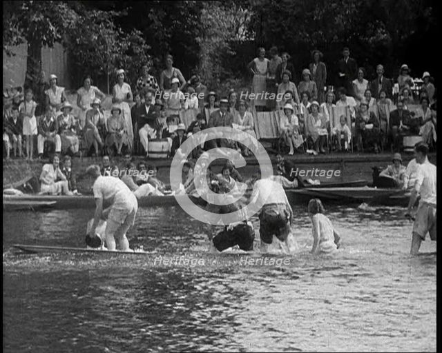 People in Sinking Rowing Boat, Watched by Crowd, 1933. Creator: British Pathe Ltd.