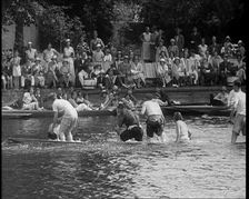 People in Sinking Rowing Boat, Watched by Crowd, 1933. Creator: British Pathe Ltd