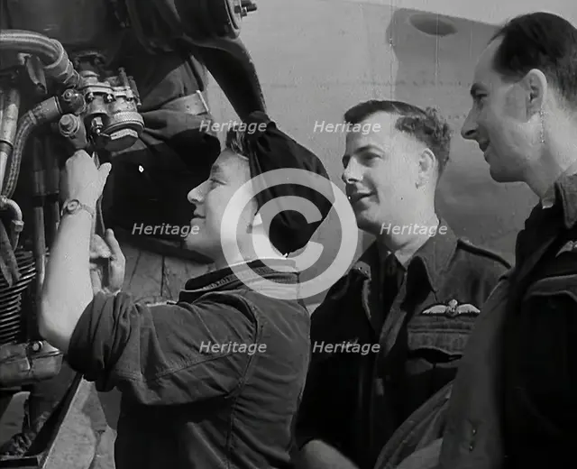 People Inspecting Part of an Aeroplane, 1942. Creator: British Pathe Ltd.