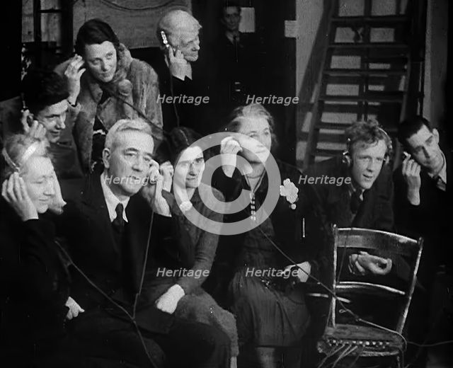 People Listening to Parents Calling Evacuee Children in America Over the Radio, 1940. Creator: British Pathe Ltd.