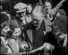 People Looking at a Paper Together, 1933. Creator: British Pathe Ltd