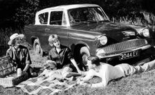 People picnicking with their 1960 Ford Anglia Deluxe, (1960?)