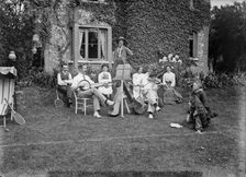 People playing music in a garden, c1896-c1920. Artist: Alfred Newton & Sons