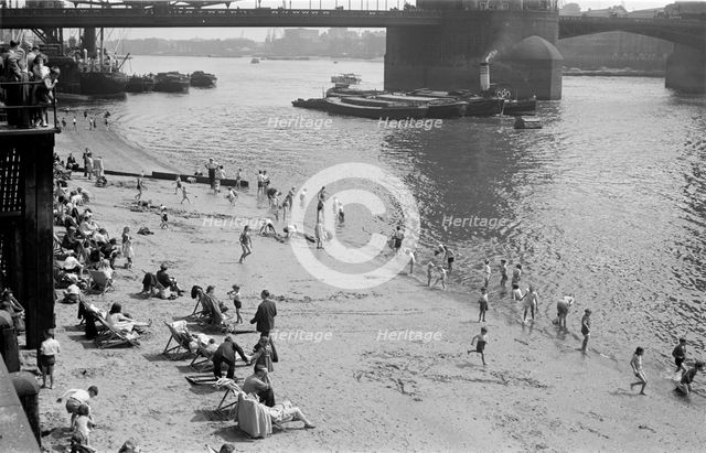 People relaxing on Tower Beach, London, c1945-c1955. Artist: SW Rawlings
