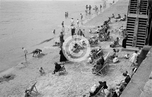 People relaxing on Tower Beach, London, c1945-c1955. Artist: SW Rawlings